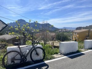 View across a Spanish valley with a bicycle in the foreground.
